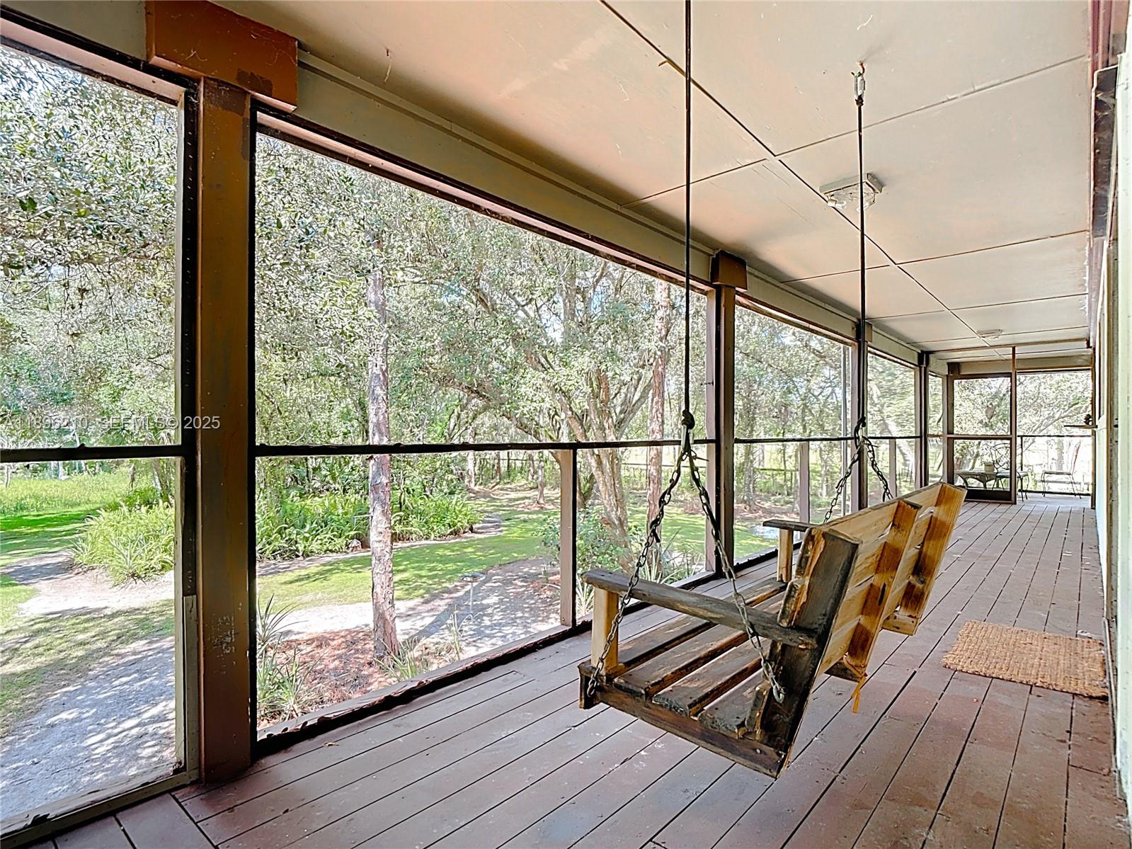 1270 Tom Coker Road LaBelle, FL 33935 - Photo 26 of 46 a view of a balcony with wooden floor