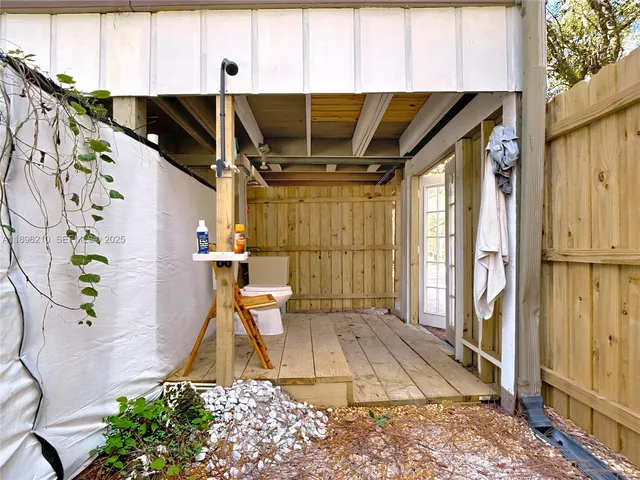 a view of a house with a yard porch and sitting area