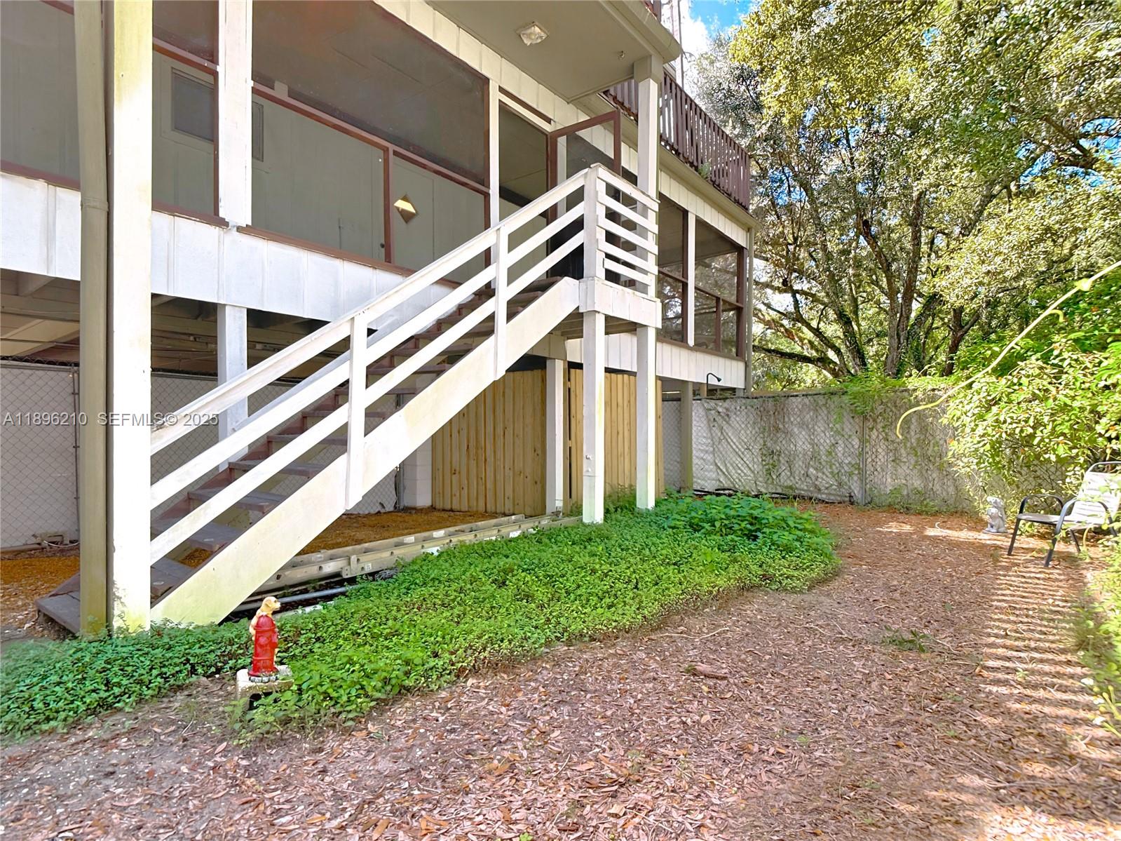 1270 Tom Coker Road LaBelle, FL 33935 - Photo 37 of 46 a view of a house with a yard and stairs