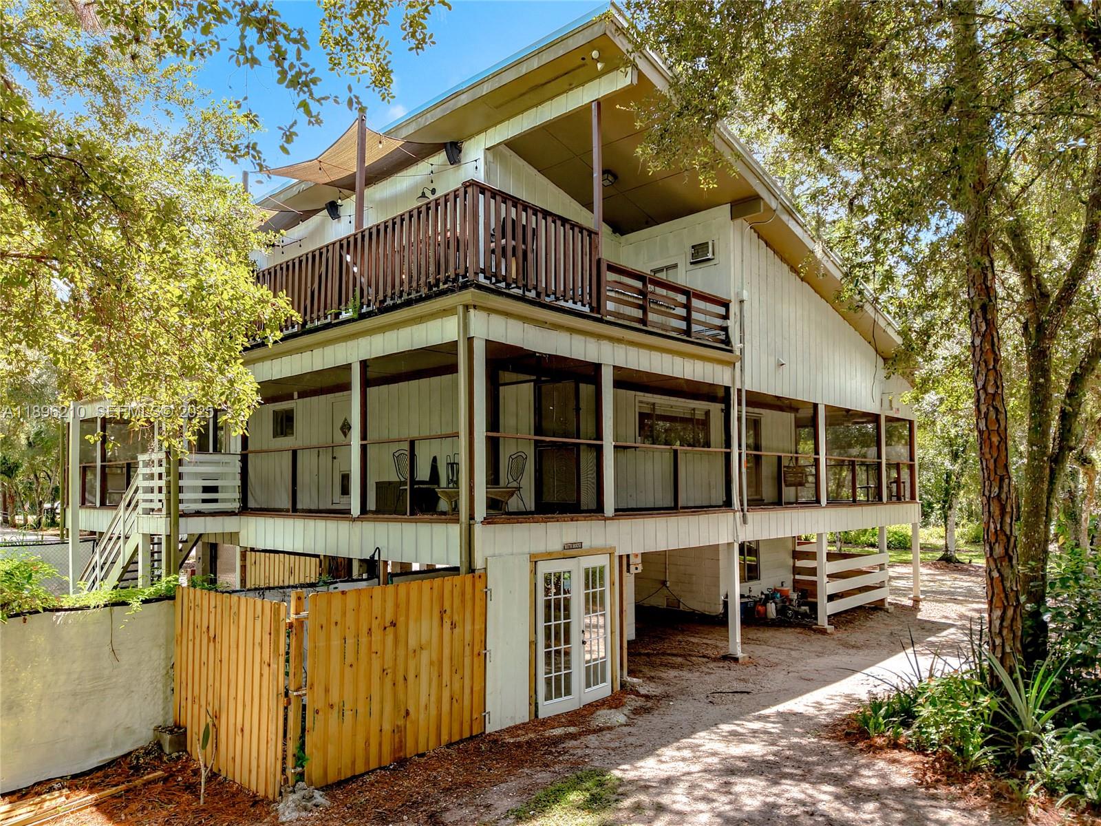 1270 Tom Coker Road LaBelle, FL 33935 - Photo 39 of 46 a view of a house with a yard