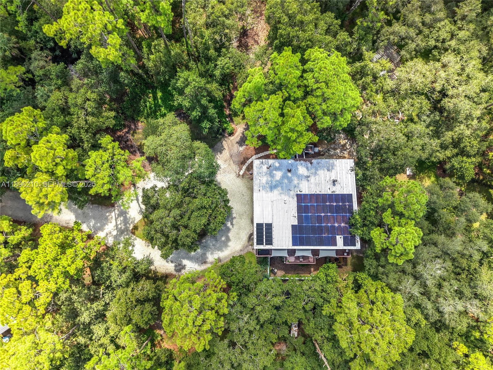 1270 Tom Coker Road LaBelle, FL 33935 - Photo 45 of 46 an aerial view of a house with a yard and garden