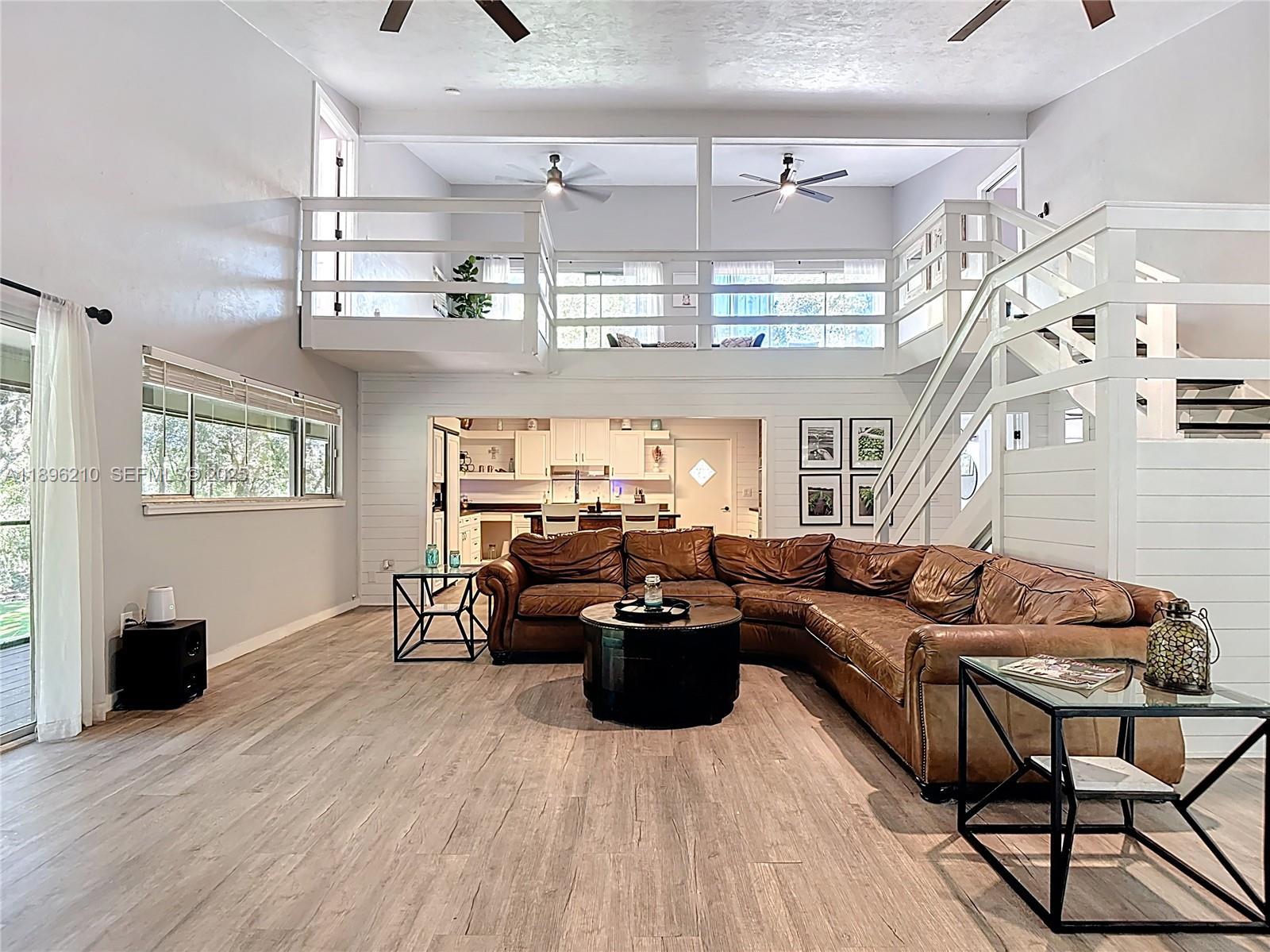 1270 Tom Coker Road LaBelle, FL 33935 - Photo 6 of 46 a living room with furniture and a flat screen tv