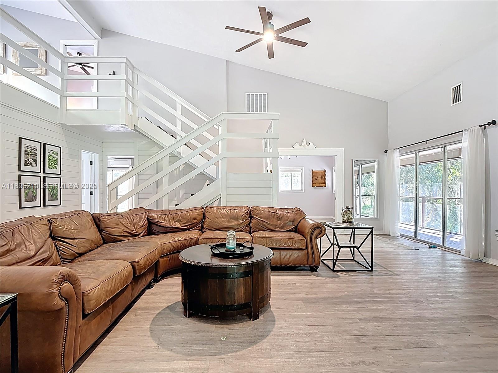 1270 Tom Coker Road LaBelle, FL 33935 - Photo 9 of 46 a living room with furniture and wooden floor