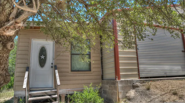 a view of dinning table and chairs in patio