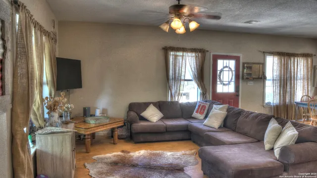 a dining room with furniture and window