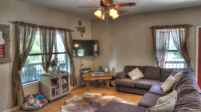 a kitchen with stainless steel appliances granite countertop a stove top oven a sink and dishwasher