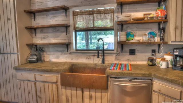 a kitchen with appliances and cabinets