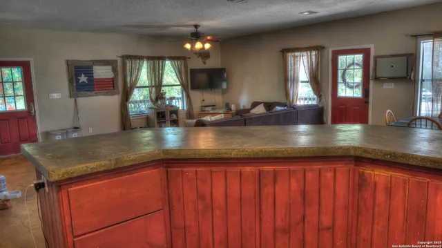a bathroom with a sink a mirror and a window