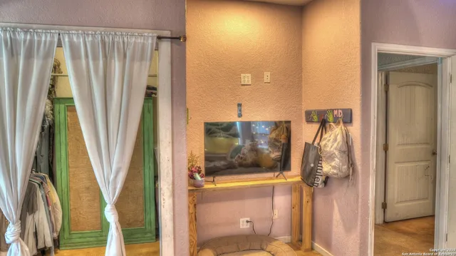 a bedroom with a bed and a mirror