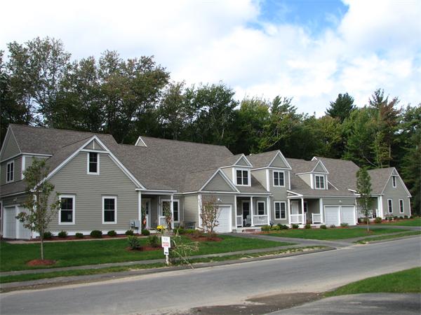 26 Sanctuary Lane, Unit 26 Hopkinton, MA 01748 - Photo 1 of 10 a aerial view of a white house