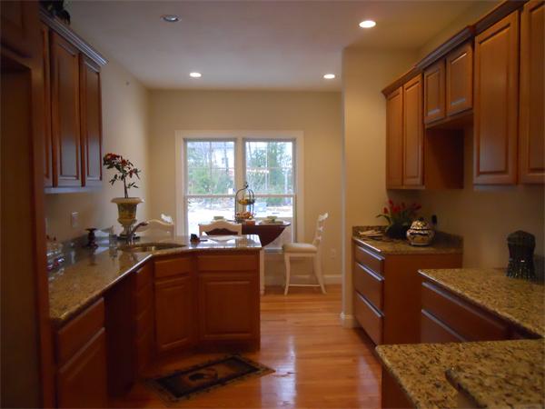 26 Sanctuary Lane, Unit 26 Hopkinton, MA 01748 - Photo 3 of 10 a kitchen with sink cabinets and appliances