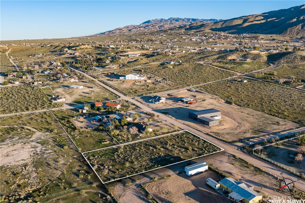 0 Moonbeam Apple Valley Apple Valley, CA 92308 - Photo 11 of 14 an aerial view of residential houses with outdoor space