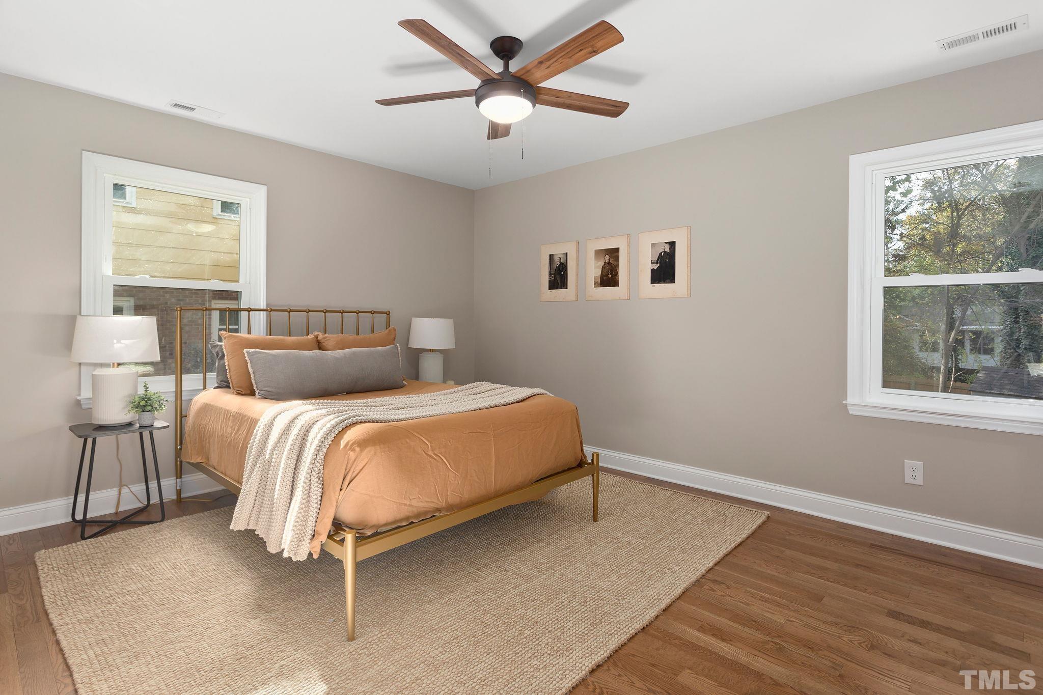 311 Lord Ashley Road Raleigh, NC 27610 - Photo 15 of 39 a bedroom with a bed and a window