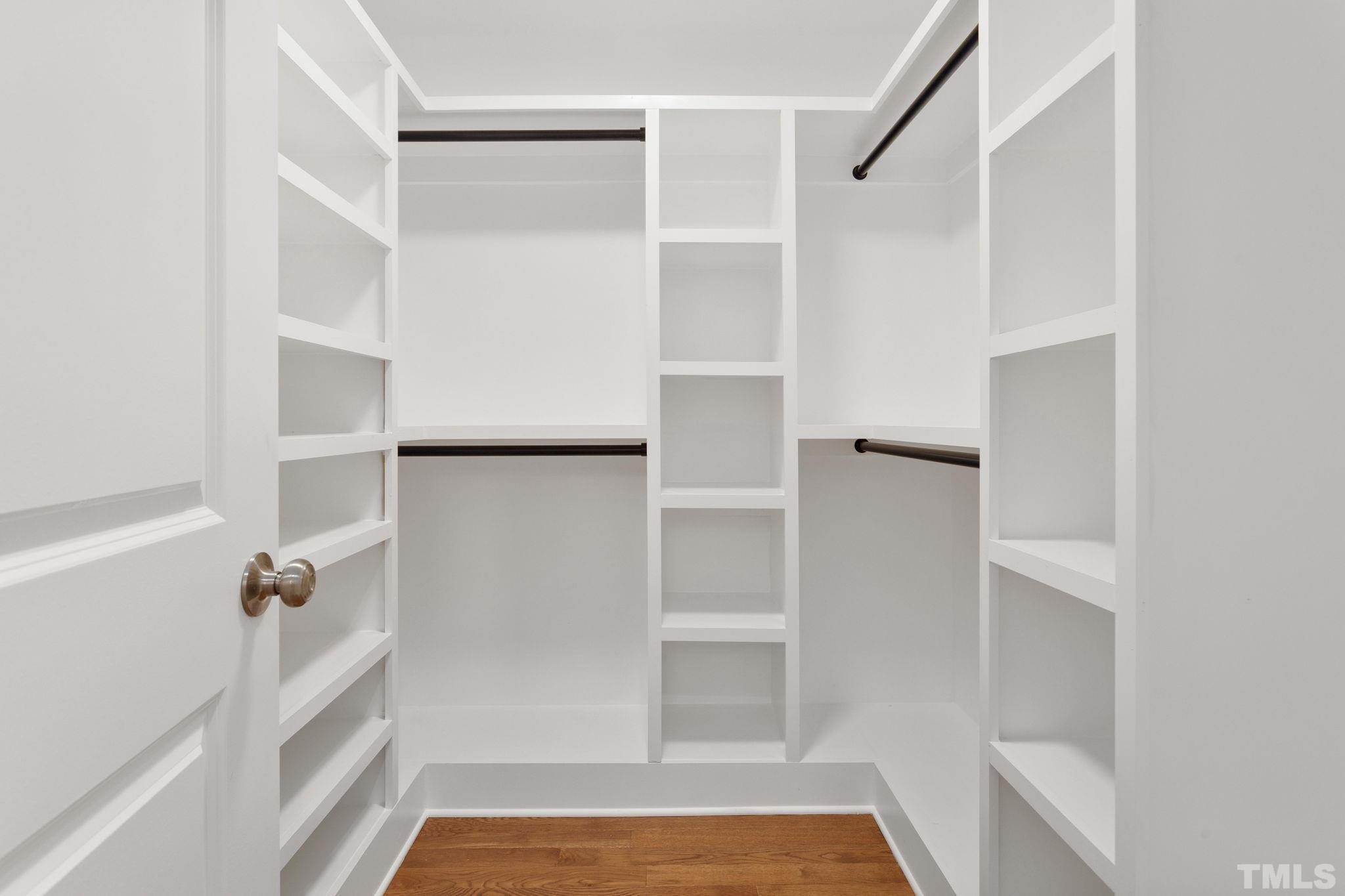 311 Lord Ashley Road Raleigh, NC 27610 - Photo 19 of 39 a view of walk in closet with empty racks