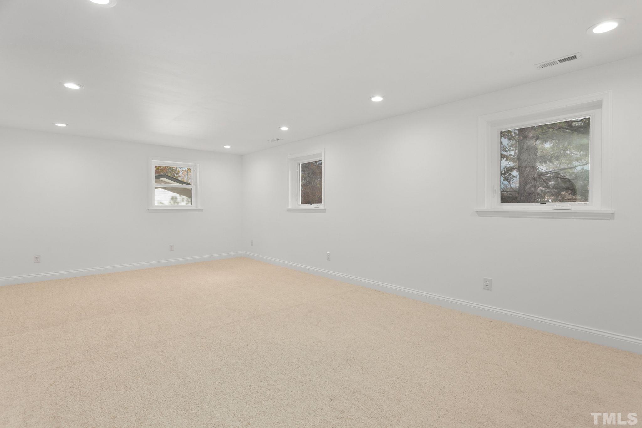 311 Lord Ashley Road Raleigh, NC 27610 - Photo 26 of 39 an empty room with a window