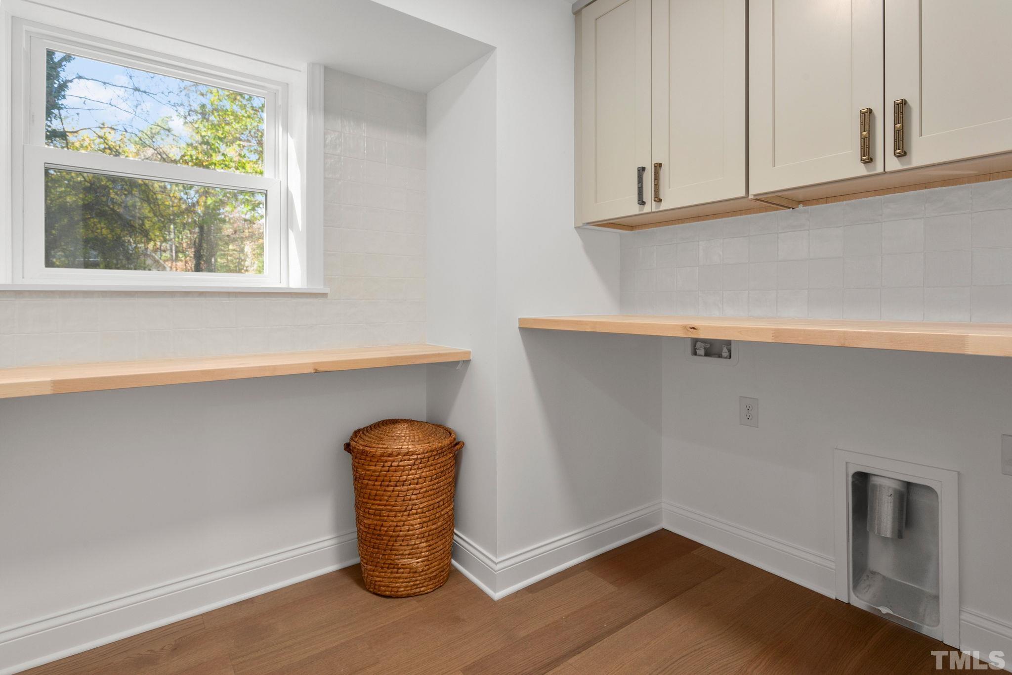 311 Lord Ashley Road Raleigh, NC 27610 - Photo 28 of 39 a close view of cabinet with tap