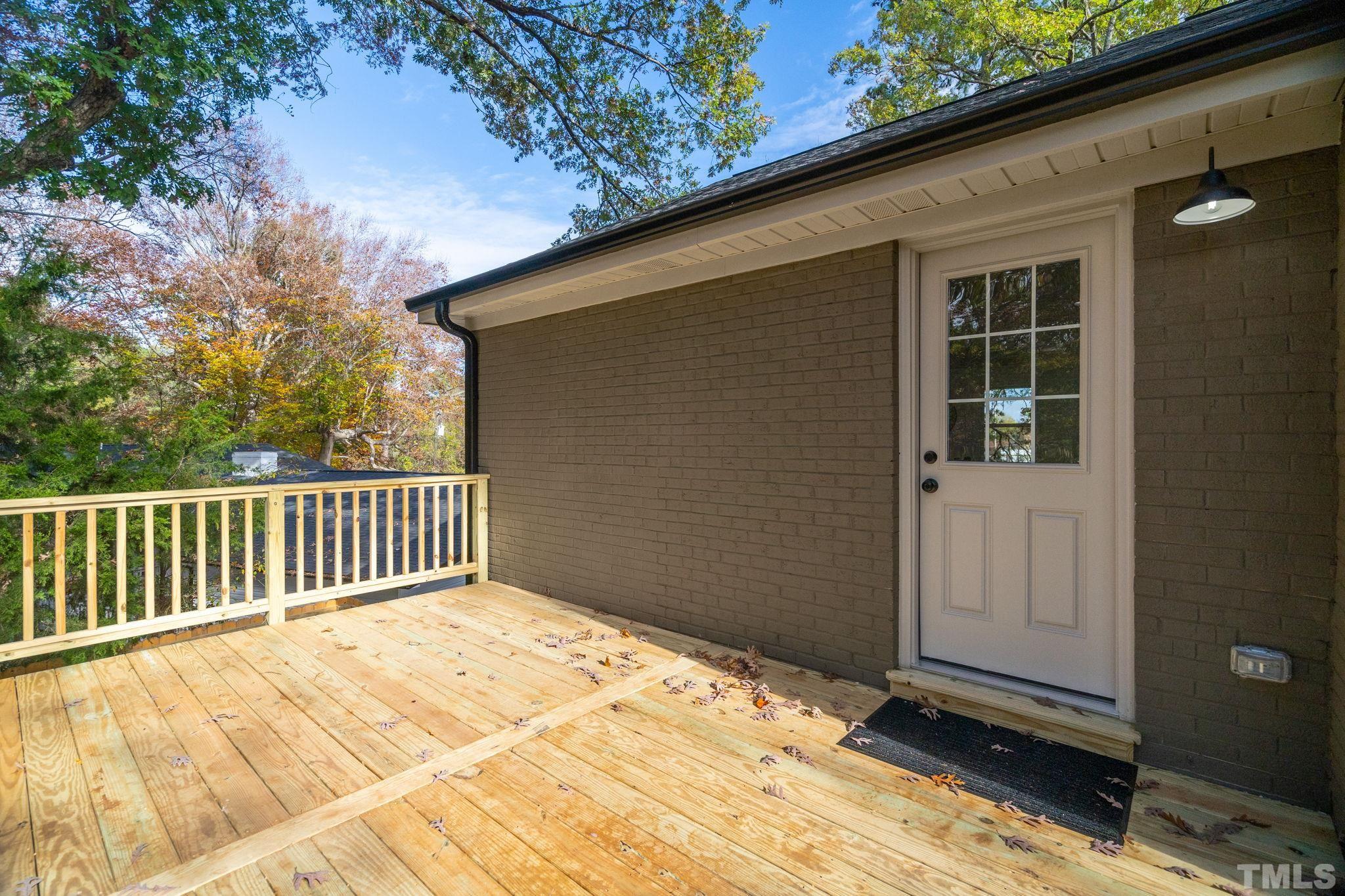 311 Lord Ashley Road Raleigh, NC 27610 - Photo 31 of 39 a view of balcony and wooden floor