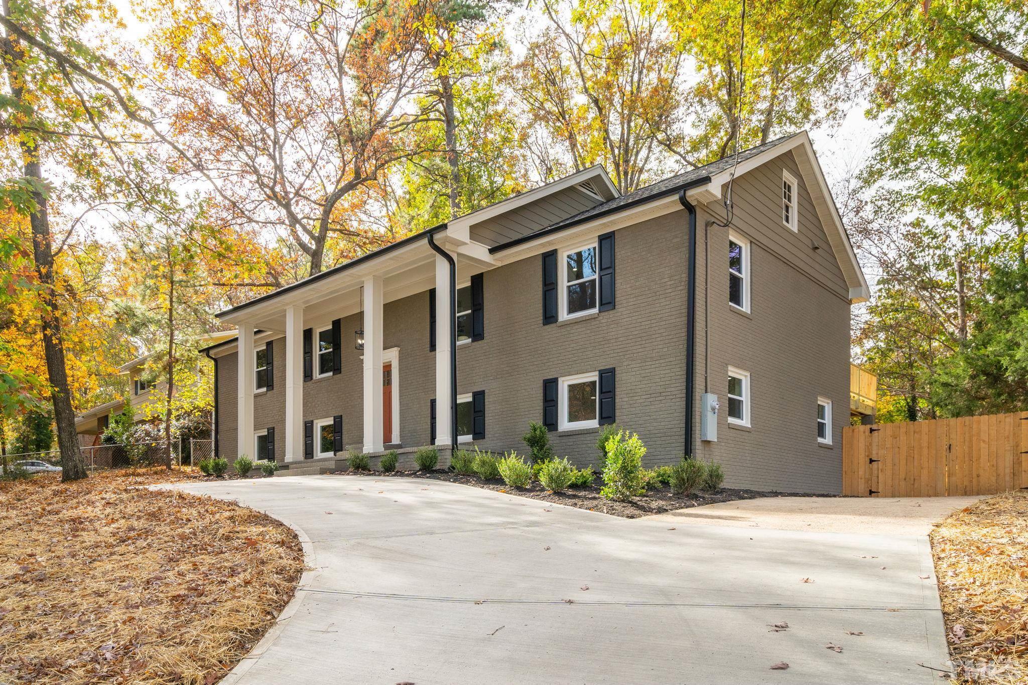311 Lord Ashley Road Raleigh, NC 27610 - Photo 4 of 39 a front view of a house with a yard and garage