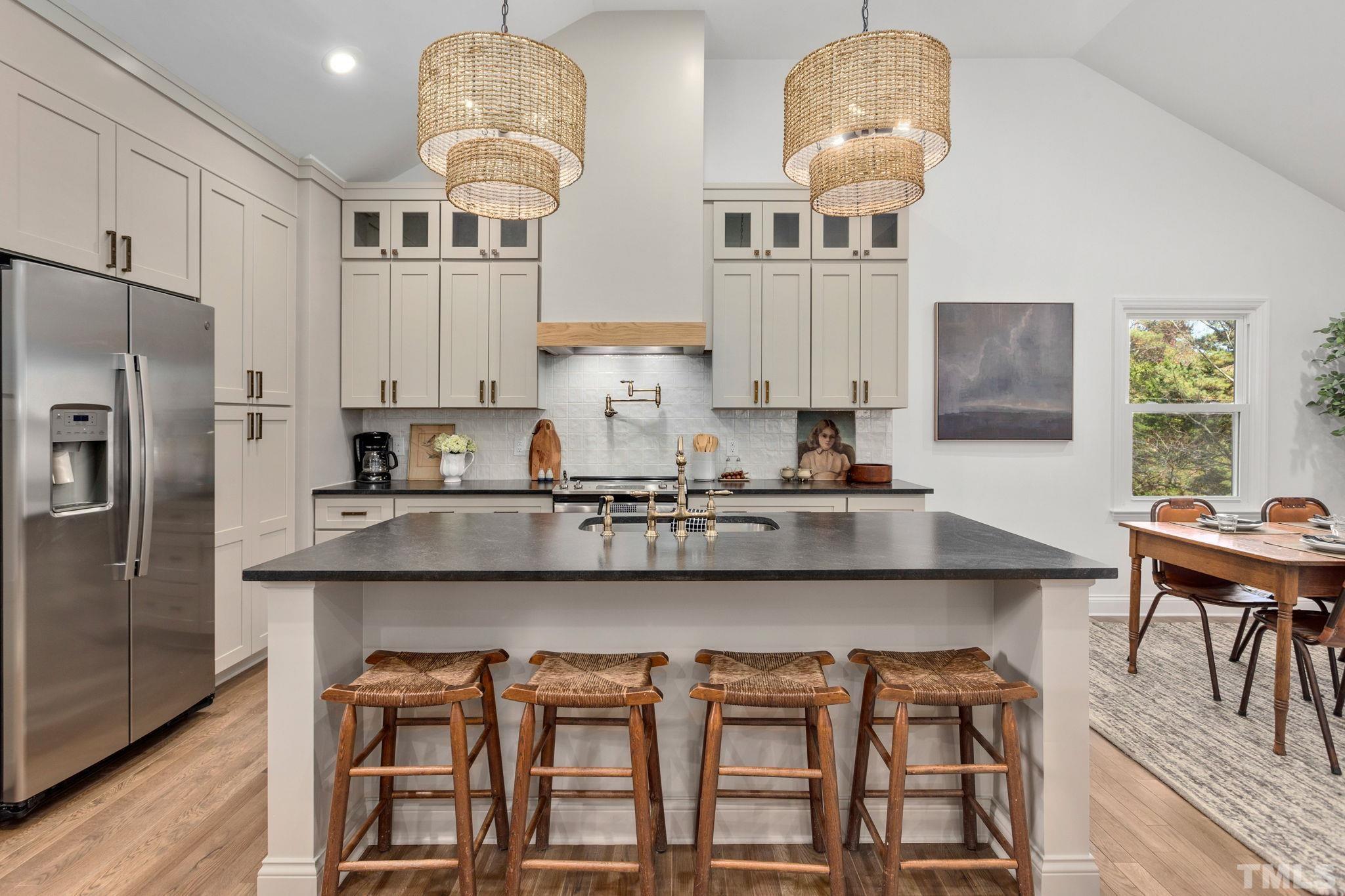 311 Lord Ashley Road Raleigh, NC 27610 - Photo 6 of 39 a kitchen with stainless steel appliances granite countertop a stove a sink and a refrigerator