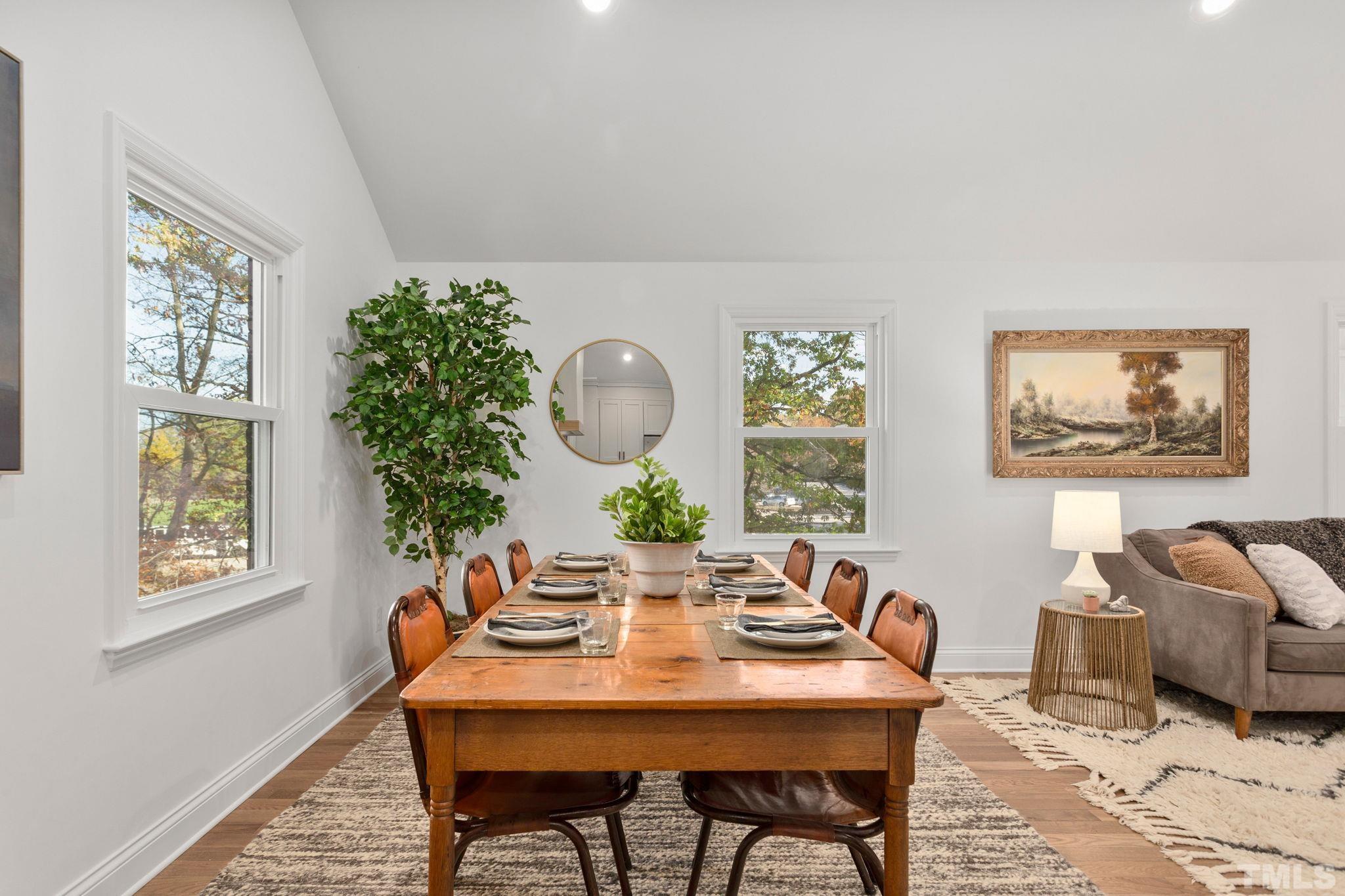 311 Lord Ashley Road Raleigh, NC 27610 - Photo 8 of 39 a view of a dining room with furniture window and wooden floor
