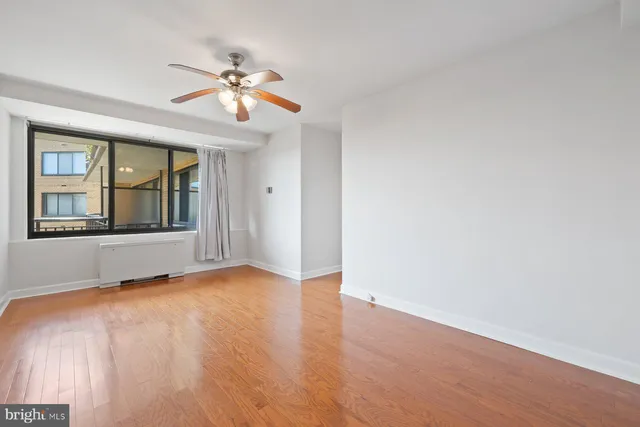 a view of an empty room with a window