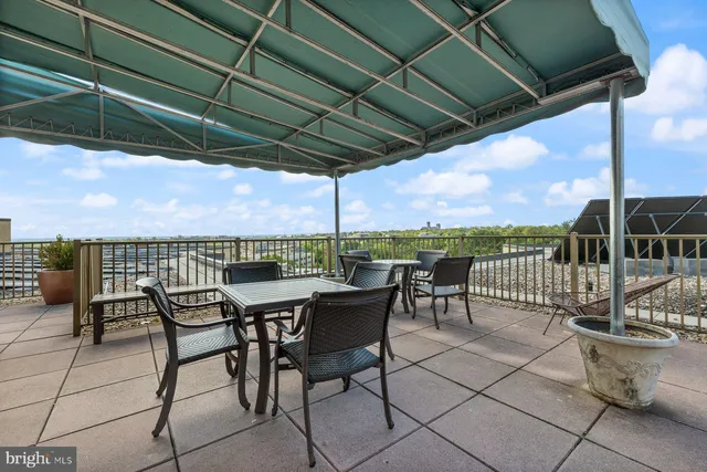 a view of chairs and table in patio