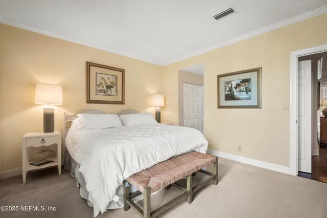 a bathroom with a sink a potted plant and a mirror