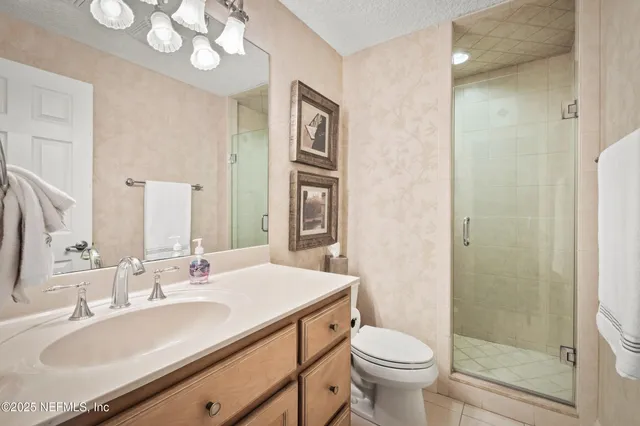 a utility room with cabinets washer and dryer