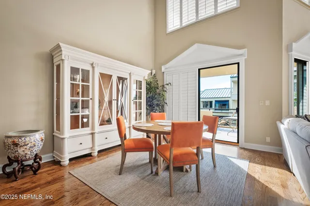 a living room with furniture fireplace and wooden floor