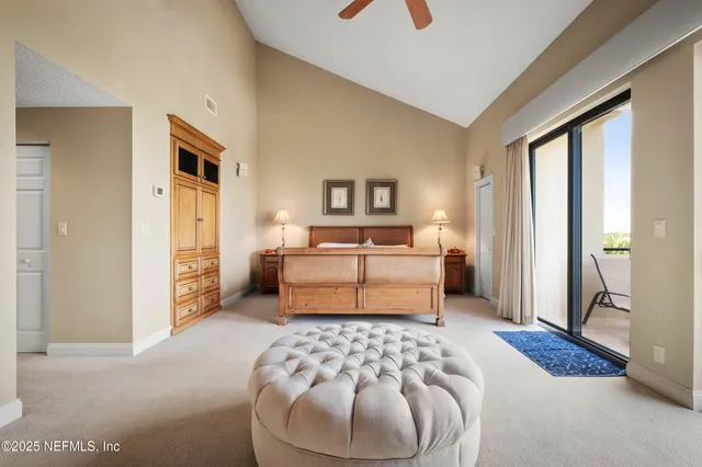 a bedroom with a bed and a couch