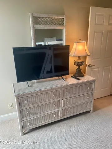 a view of a balcony with wooden floor and fence