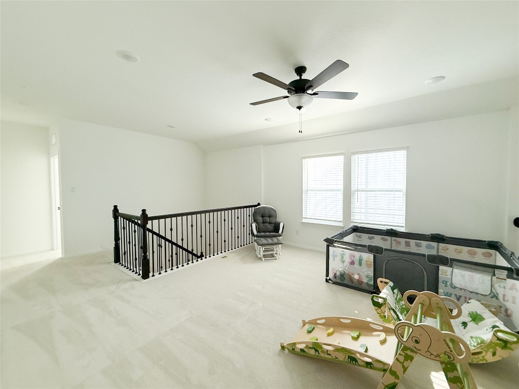 253 Inlet Lane Leander, TX 78641 - Photo 13 of 23 Sitting room with carpet, an upstairs landing, and a ceiling fan