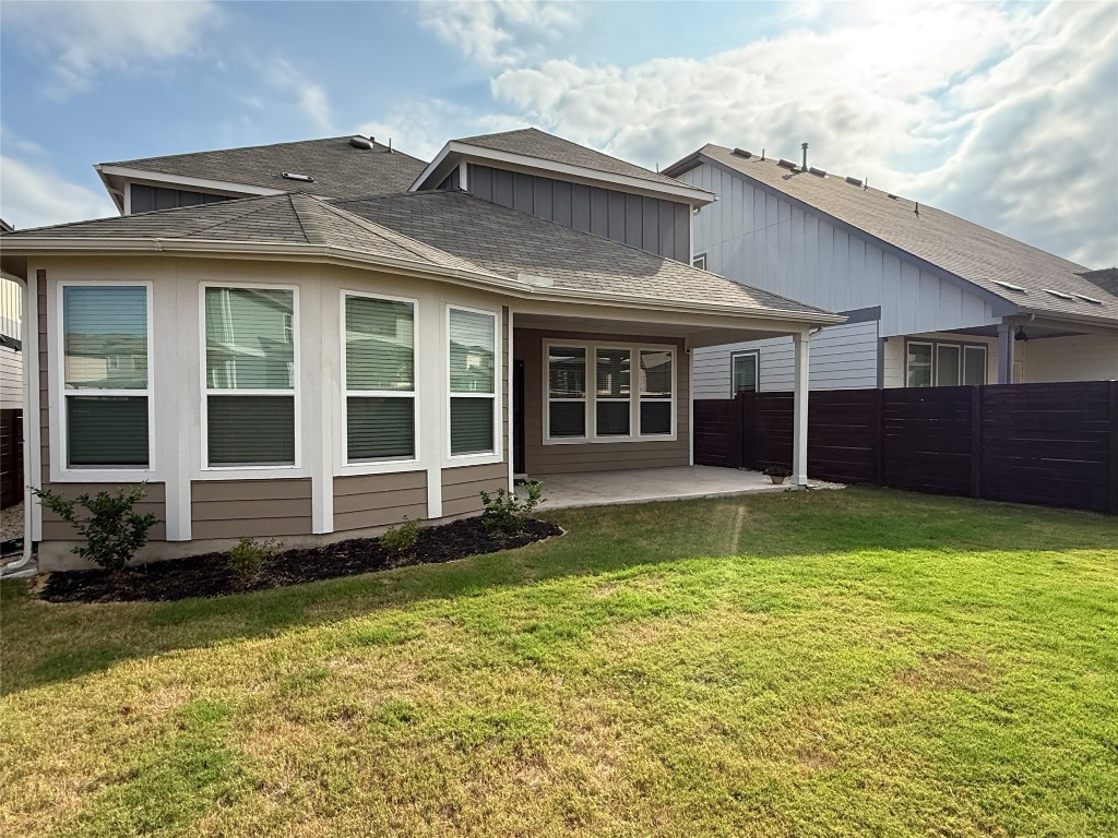 253 Inlet Lane Leander, TX 78641 - Photo 22 of 23 Rear view of property with a patio, board and batten siding, and roof with shingles