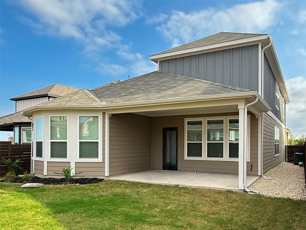253 Inlet Lane Leander, TX 78641 - Photo 23 of 23 Back of house featuring a patio, board and batten siding, and a shingled roof