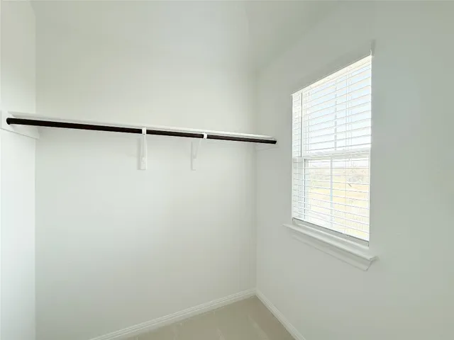 a bathroom with a shower and a bath tub