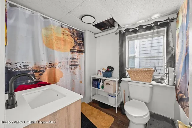 a bathroom with a sink toilet tub and shower