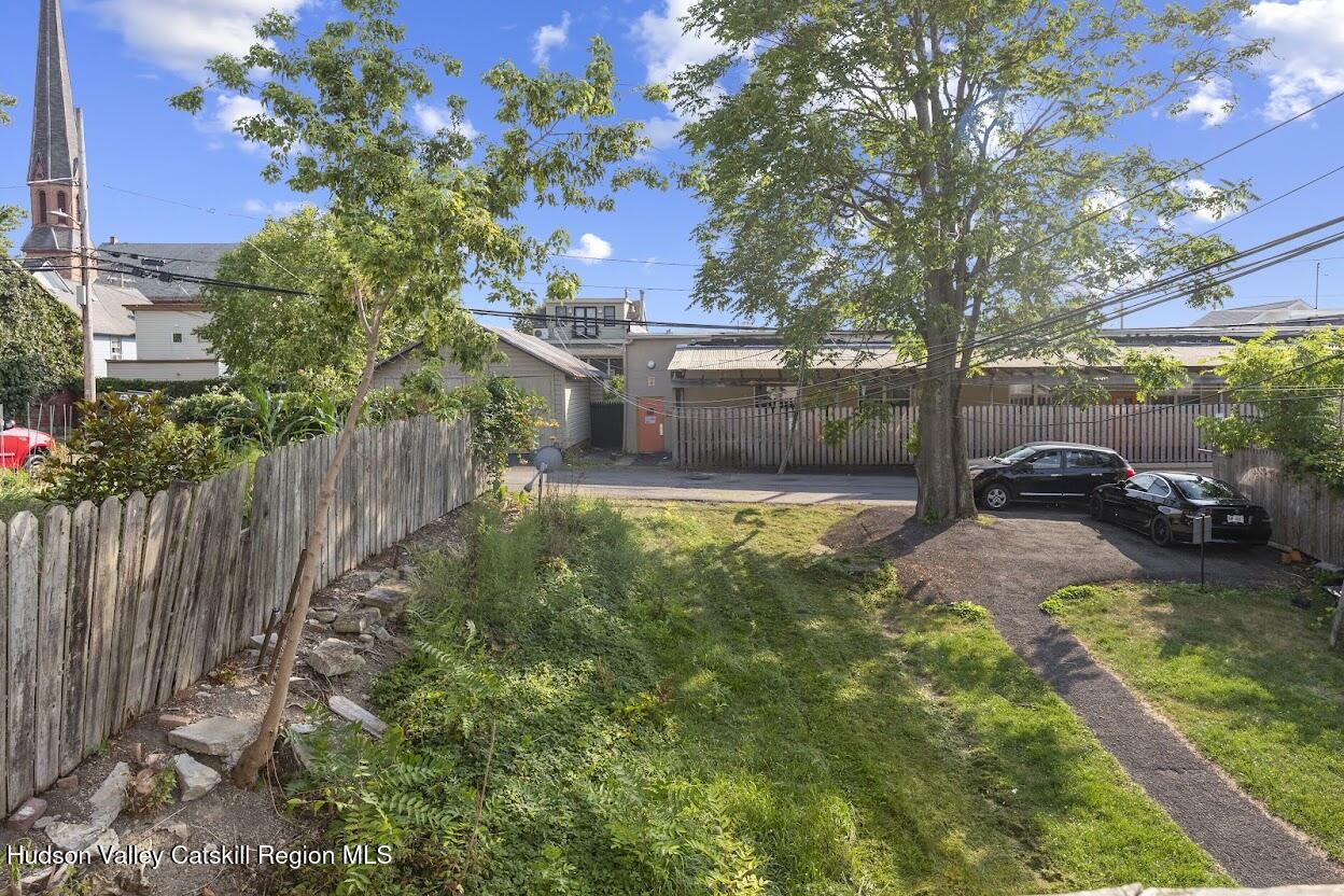 543 State Street, Unit 2 Hudson, NY 12534 - Photo 13 of 22 a view of a house with a yard and sitting area