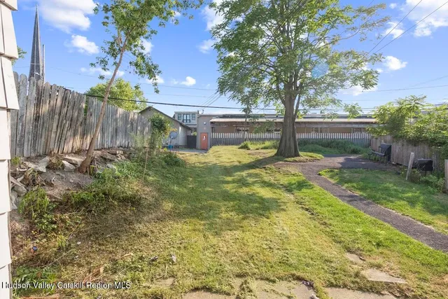a view of backyard with tree