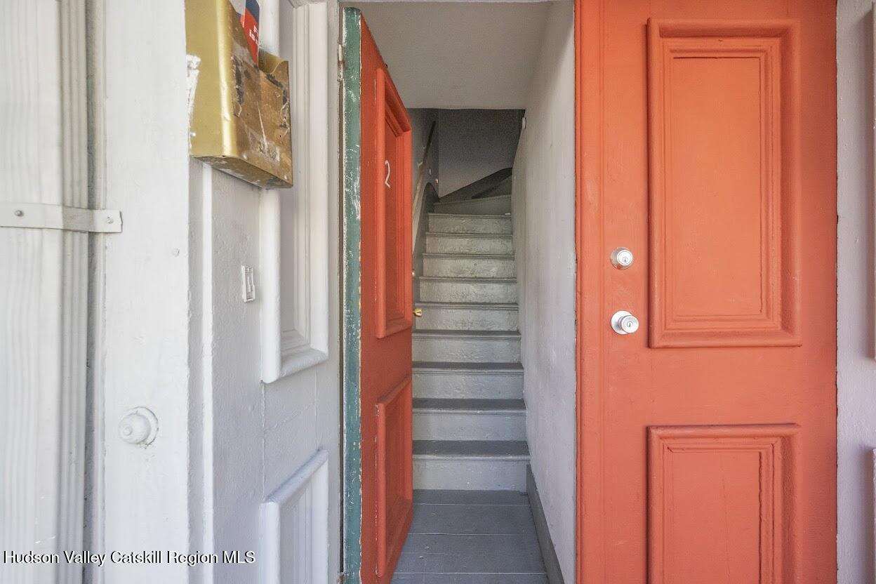 543 State Street, Unit 2 Hudson, NY 12534 - Photo 2 of 22 a view of front door with hallway and stairs