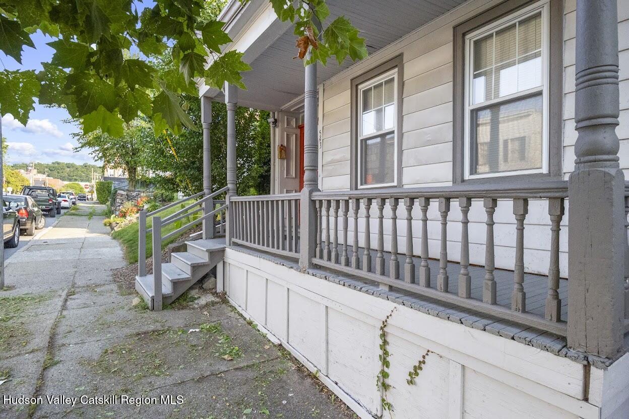 543 State Street, Unit 2 Hudson, NY 12534 - Photo 21 of 22 a view of a chair and tables in the balcony