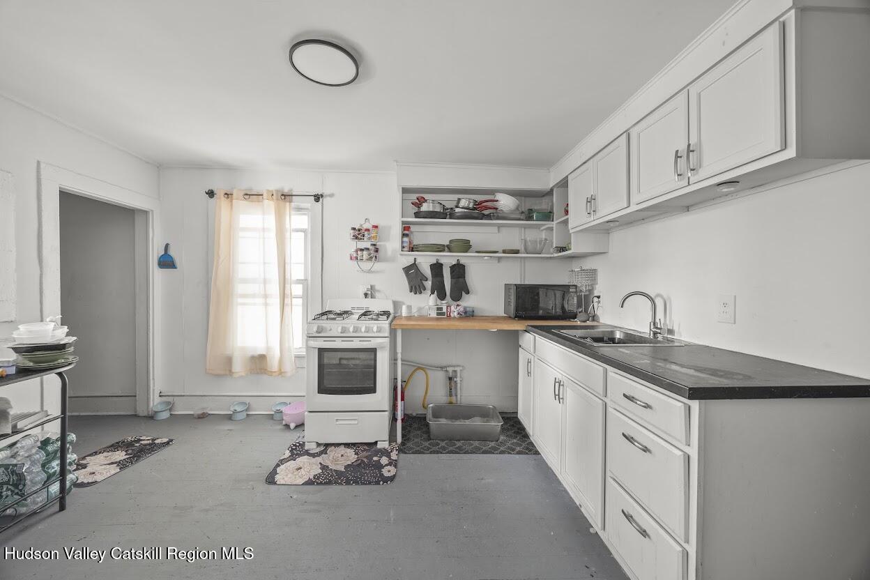 543 State Street, Unit 2 Hudson, NY 12534 - Photo 3 of 22 a kitchen with sink cabinets and window