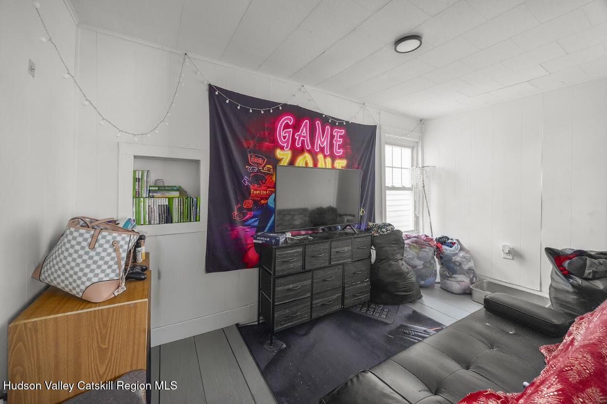 543 State Street, Unit 2 Hudson, NY 12534 - Photo 10 of 22 a living room with furniture and a flat screen tv