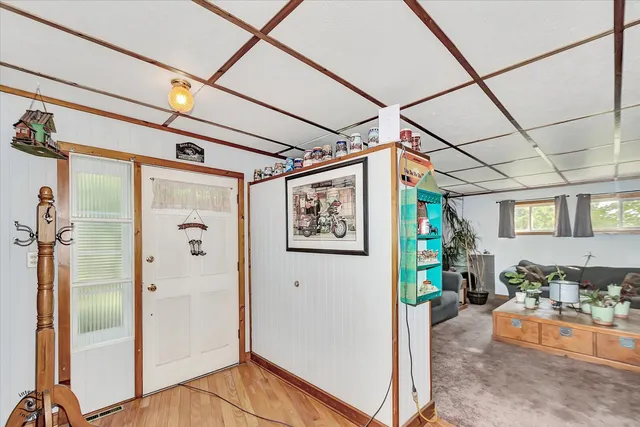a view of hallway with livingroom and furniture
