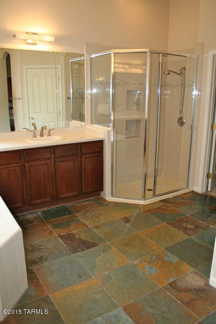 1729 East Redstart Road Green Valley, AZ 85614 - Photo 27 of 39 a bathroom with a sink and a mirror