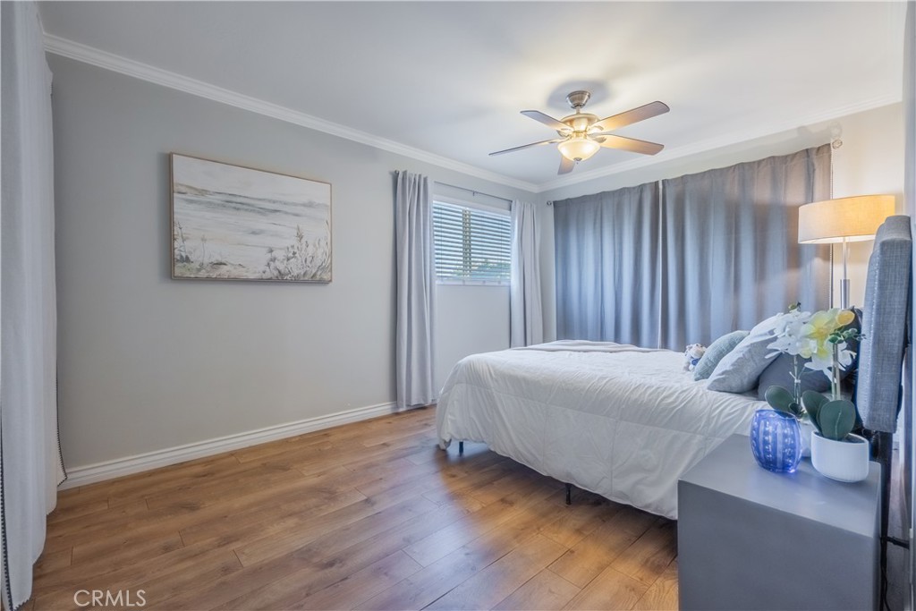 630 South Knott, Unit 14 Anaheim, CA 92804 - Photo 11 of 26 a bedroom with a bed and a chandelier