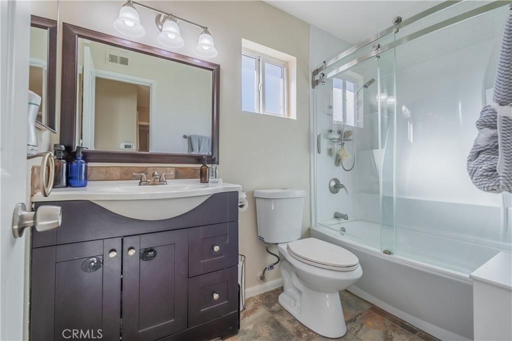 630 South Knott, Unit 14 Anaheim, CA 92804 - Photo 16 of 26 a bathroom with a sink toilet a mirror and shower