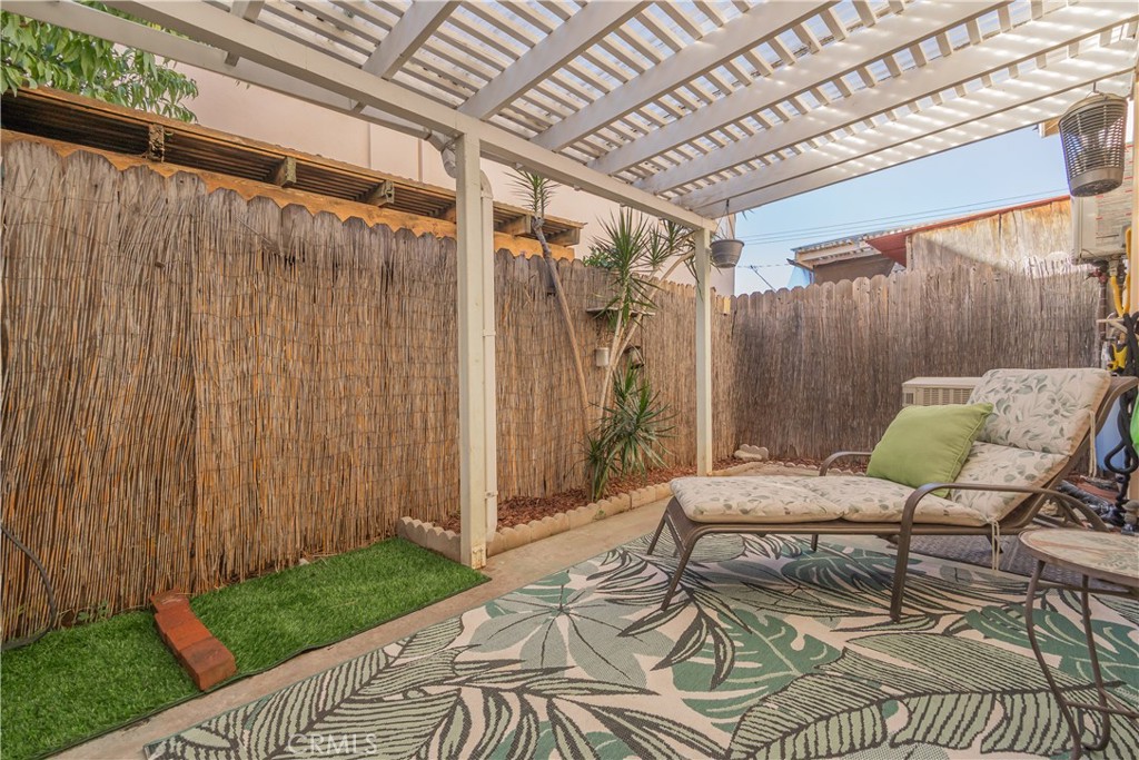 630 South Knott, Unit 14 Anaheim, CA 92804 - Photo 19 of 26 a bedroom with a bed and a chair