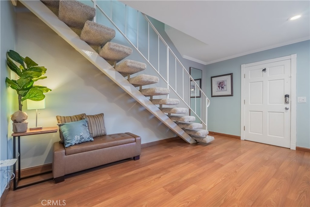630 South Knott, Unit 14 Anaheim, CA 92804 - Photo 2 of 26 a living room with furniture and stairs
