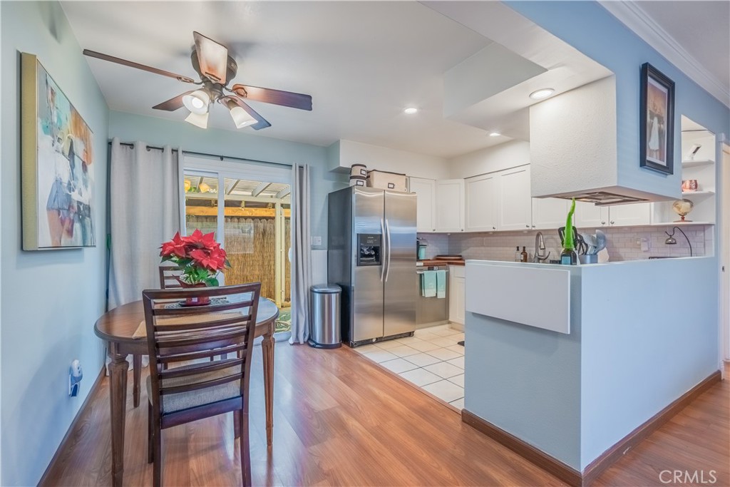 630 South Knott, Unit 14 Anaheim, CA 92804 - Photo 7 of 26 a kitchen view with stainless steel appliances kitchen island granite countertop a refrigerator and a stove top oven