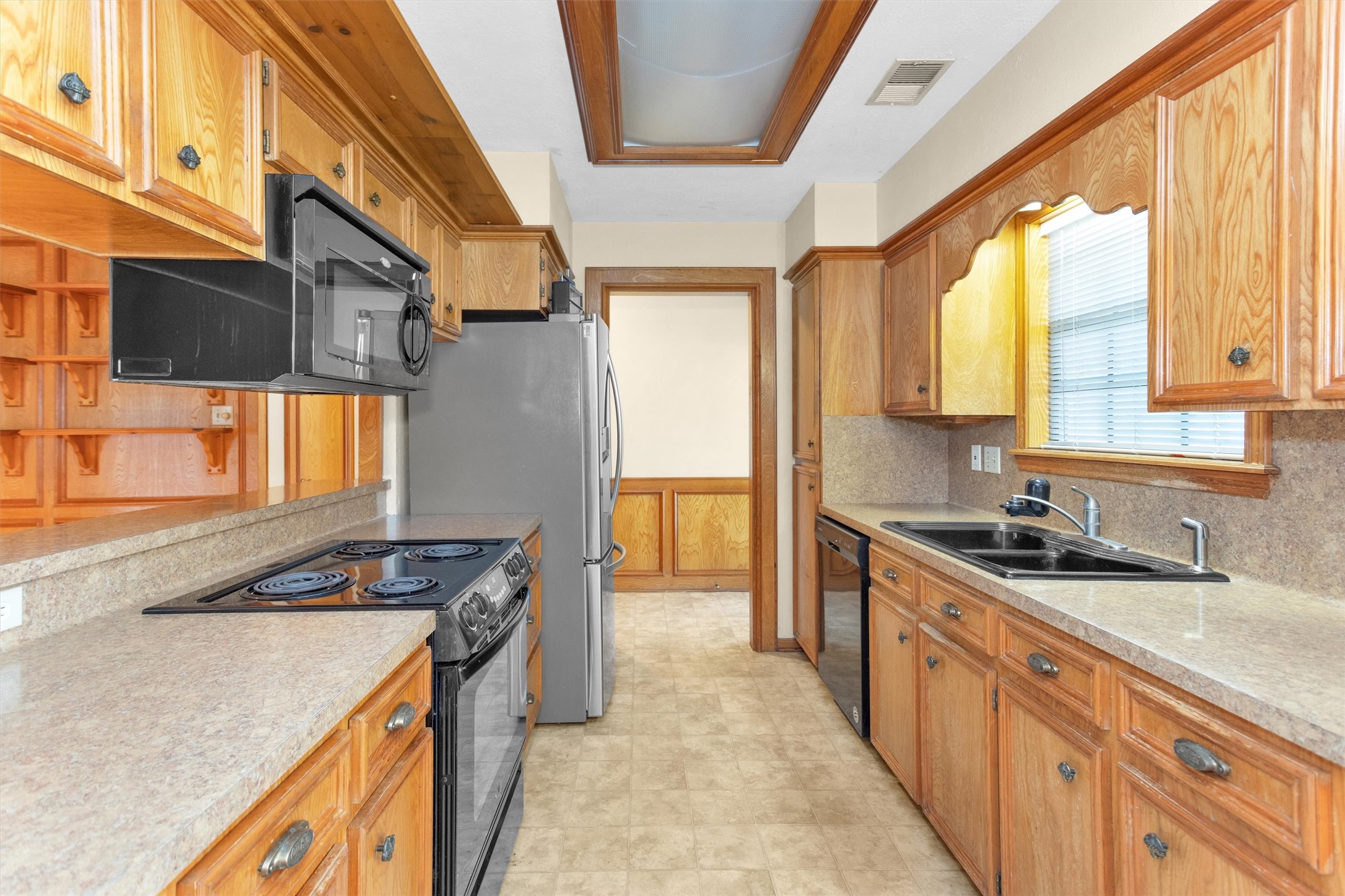 1706 Shawnee Street Navasota, TX 77868 - Photo 12 of 29 a kitchen that has a sink and a stove
